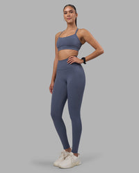 Woman wearing Fusion Ultra High-Rise Full Length Legging Pockets - Night Shadow | Model:Rhiley | Size:S