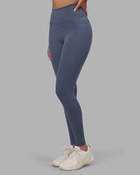 Woman wearing Fusion Ultra High-Rise Full Length Legging Pockets - Night Shadow | Model:Rhiley | Size:S