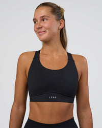 Woman wearing Fusion Sports Bra 2.0 - Black | Model:Amity | Size:S | Thumbnail Index: 0