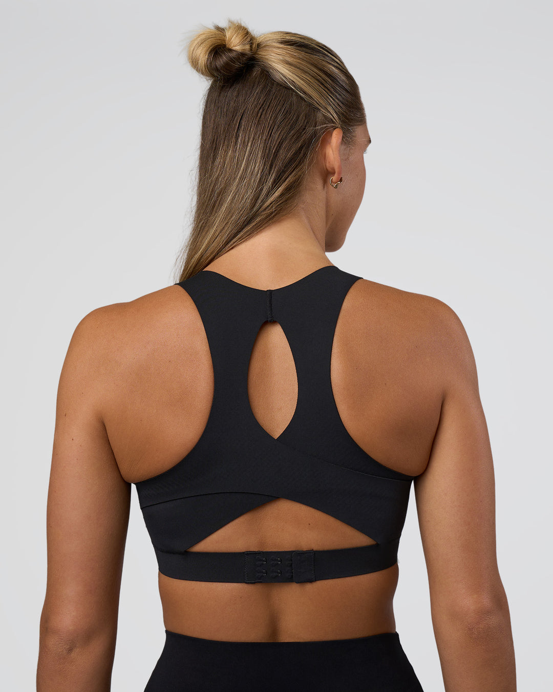 Woman wearing Fusion Sports Bra 2.0 - Black | Model:Amity | Size:S - view 2