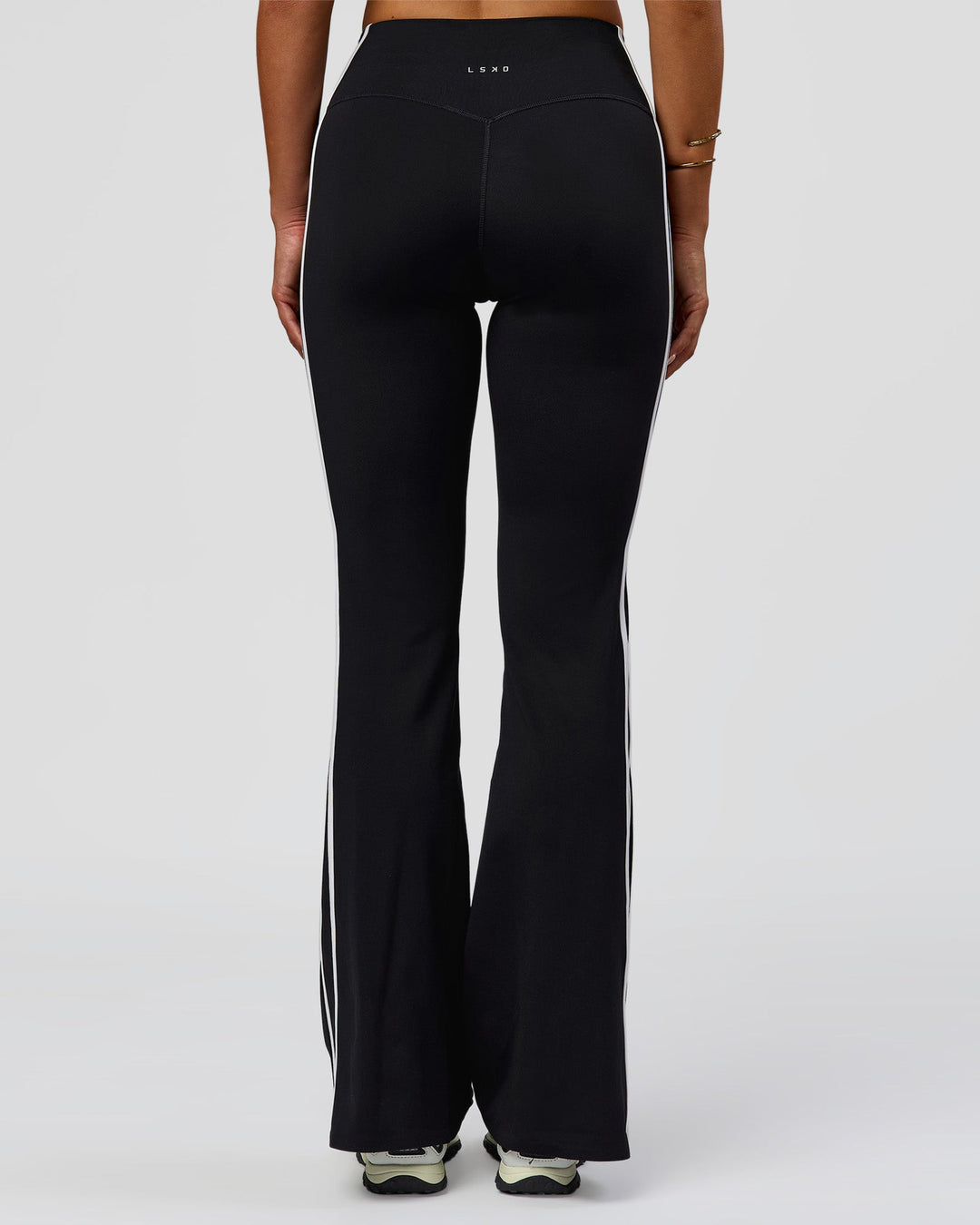 Woman wearing Fusion V-Contour Bind High-Rise Flared Legging - Black-white | Model:Bianca | Size:S - view 2