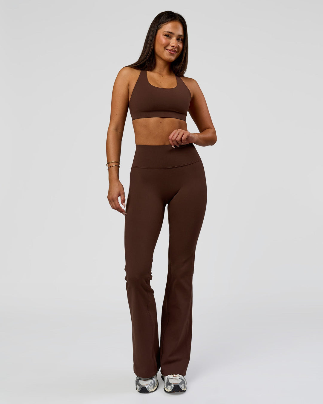 Woman wearing Fusion V-Contour Bind High-Rise Flared Legging - Hot Chocolate-white | Model:Bianca | Size:S