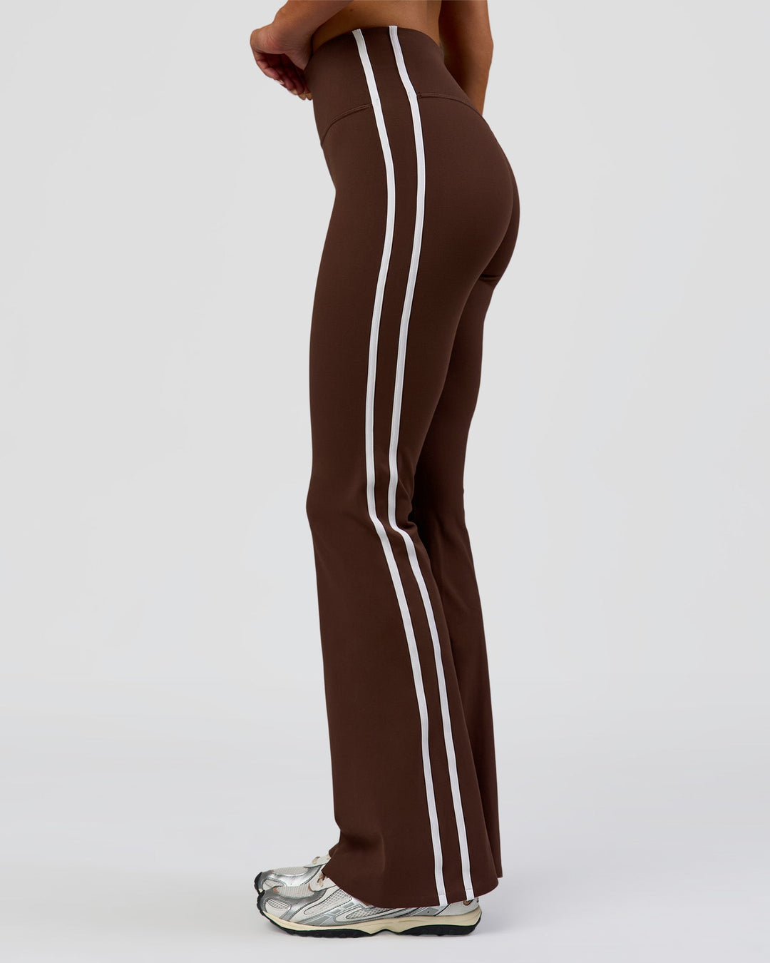 Woman wearing Fusion V-Contour Bind High-Rise Flared Legging - Hot Chocolate-white | Model:Bianca | Size:S