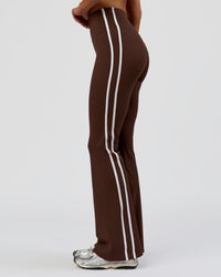 Woman wearing Fusion V-Contour Bind High-Rise Flared Legging - Hot Chocolate-white | Model:Bianca | Size:S