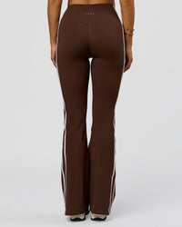 Woman wearing Fusion V-Contour Bind High-Rise Flared Legging - Hot Chocolate-white | Model:Bianca | Size:S