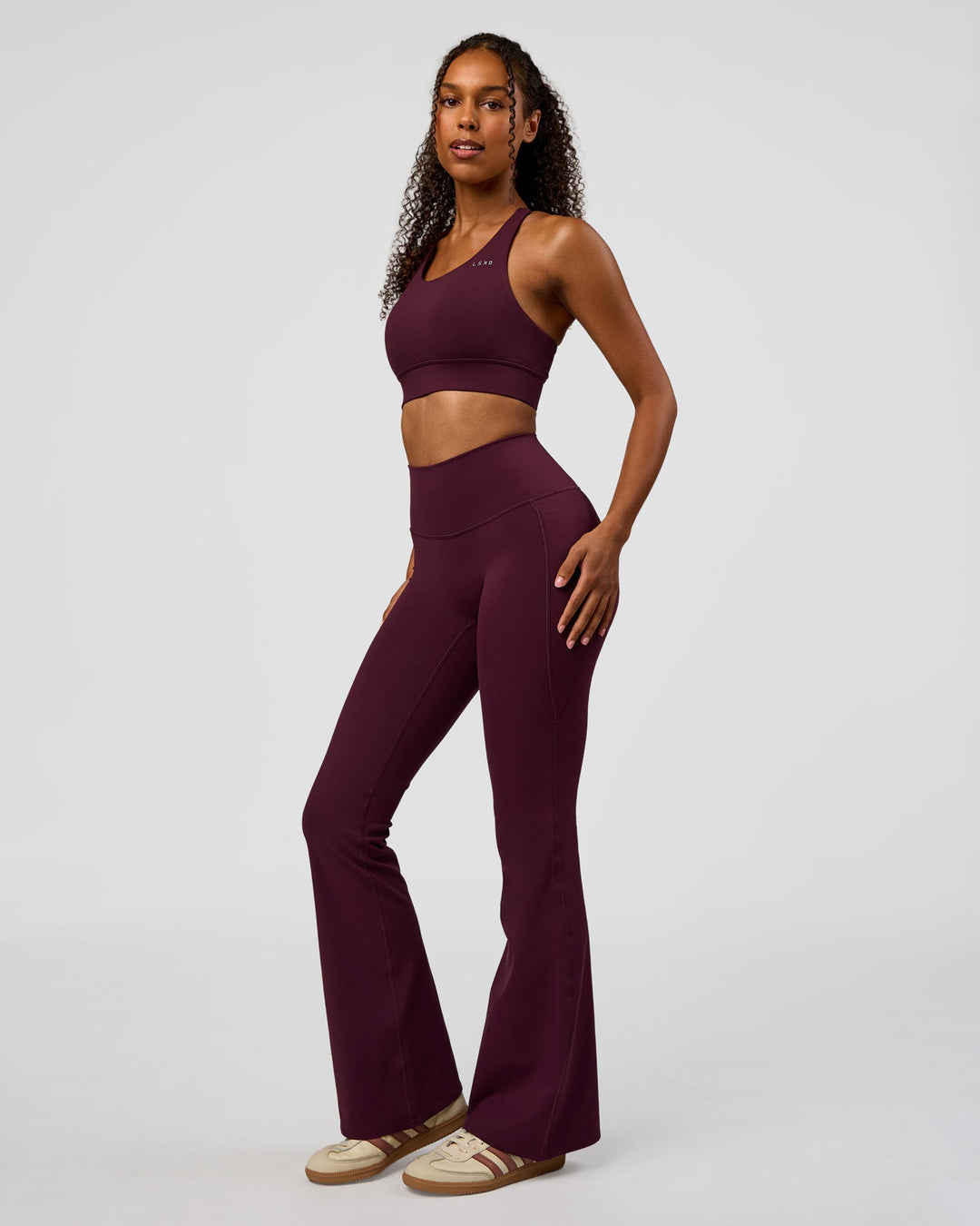 Woman wearing Fusion V-Contour High-Rise Flared Legging Pockets - Cherry Lacquer | Model:Jordan | Size:S - view 9