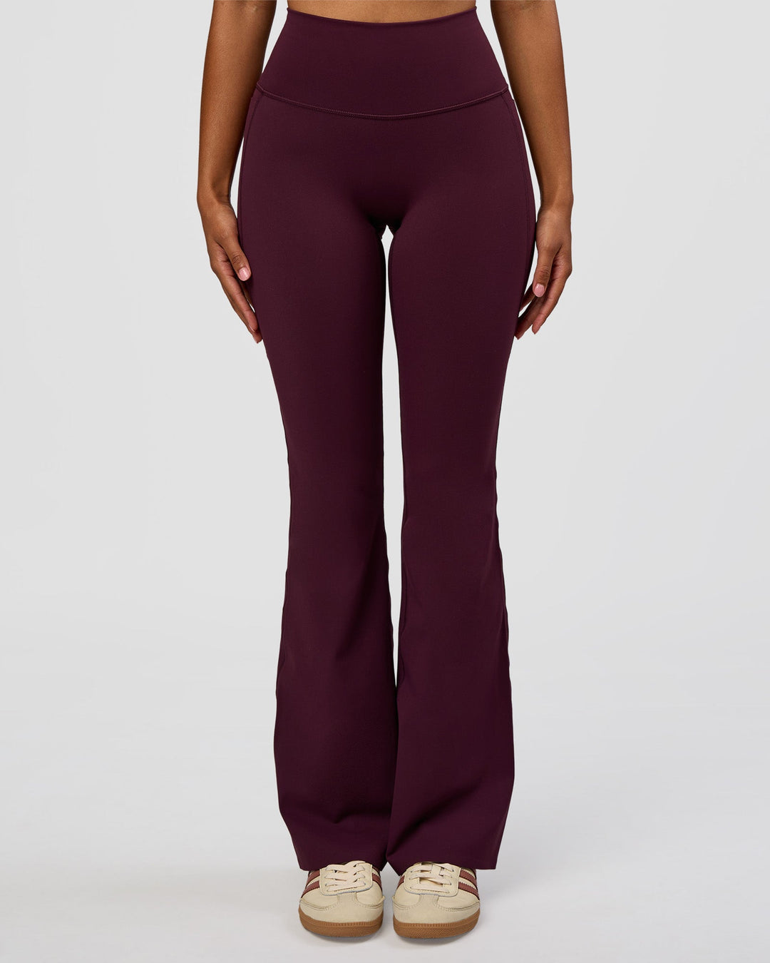 Woman wearing Fusion V-Contour High-Rise Flared Legging Pockets - Cherry Lacquer | Model:Jordan | Size:S - view 1