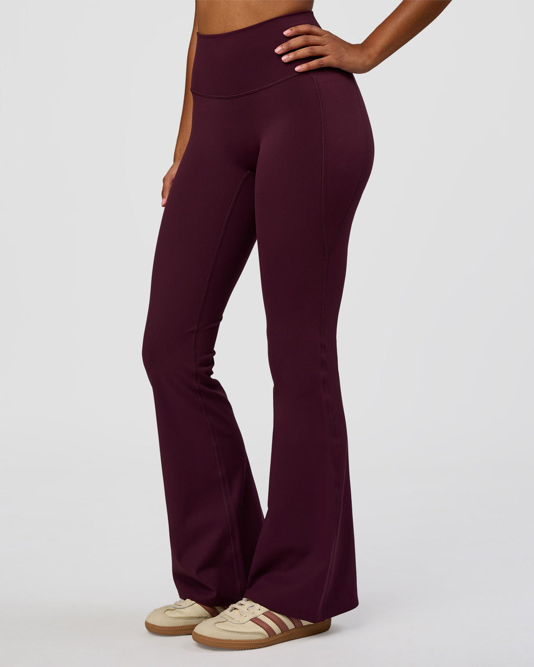 Woman wearing Fusion V-Contour High-Rise Flared Legging Pockets - Cherry Lacquer | Model:Jordan | Size:S - view 2