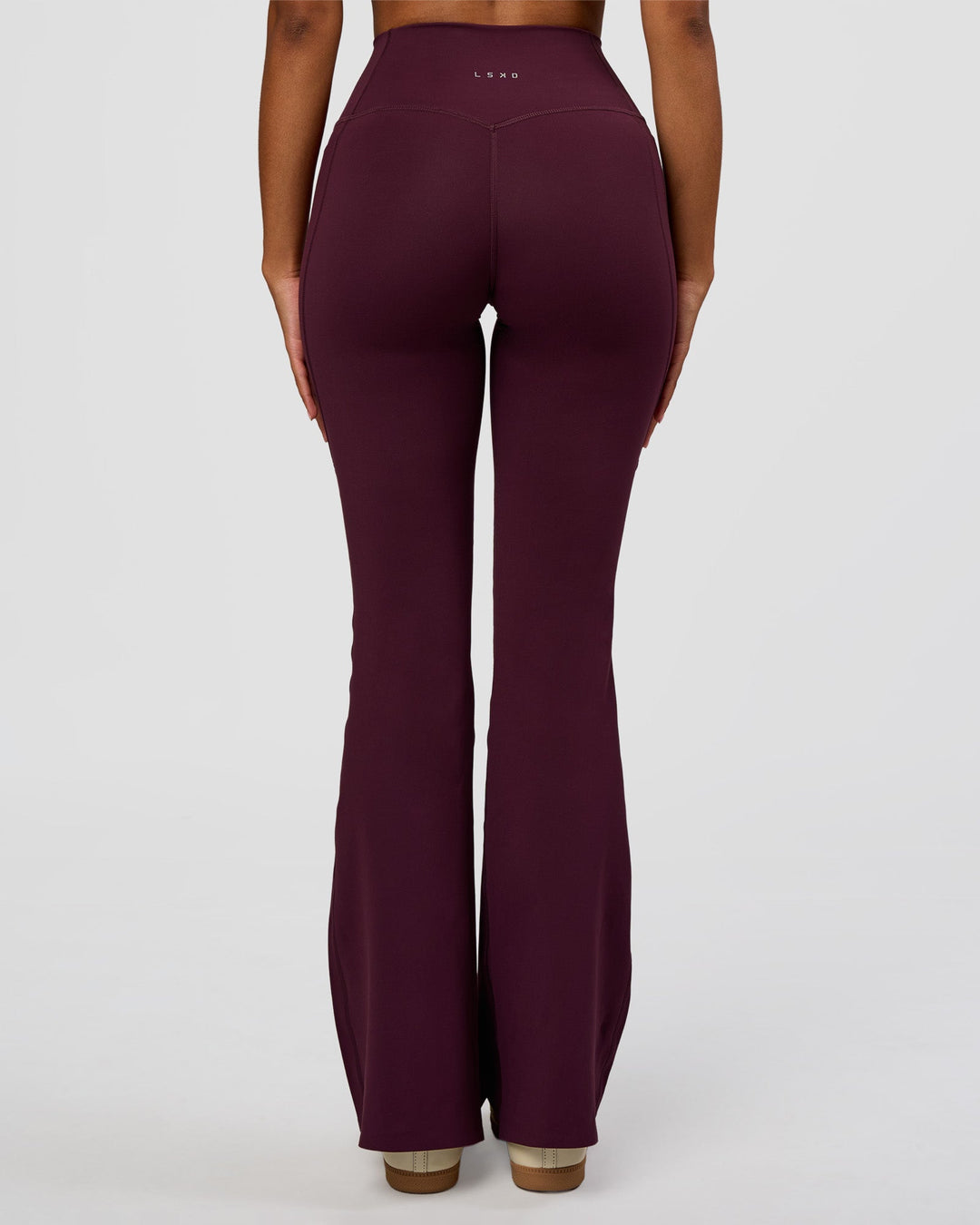 Woman wearing Fusion V-Contour High-Rise Flared Legging Pockets - Cherry Lacquer | Model:Jordan | Size:S - view 4