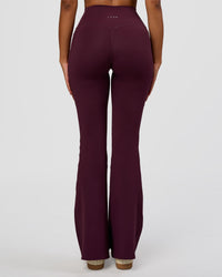 Woman wearing Fusion V-Contour High-Rise Flared Legging Pockets - Cherry Lacquer | Model:Jordan | Size:S | Thumbnail Index: 3