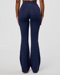 Woman wearing Fusion V-Contour High-Rise Flared Legging Pockets - Future Navy | Model:Jordan | Size:S