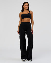 Woman wearing Fusion V-Contour High-Rise Pant - Black | Model:Bianca | Size:S
