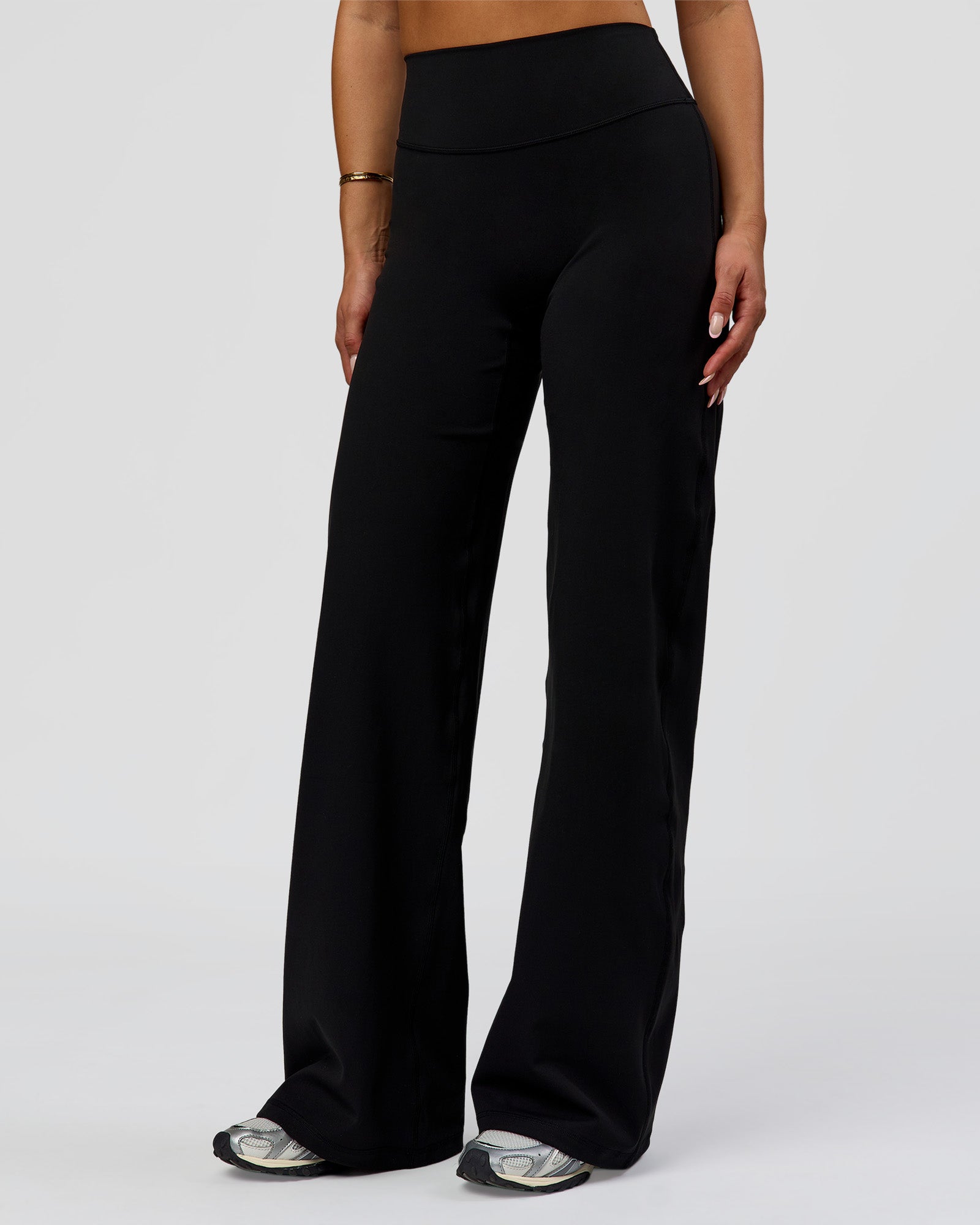 Woman wearing Fusion V-Contour High-Rise Pant - Black | Model:Bianca | Size:S