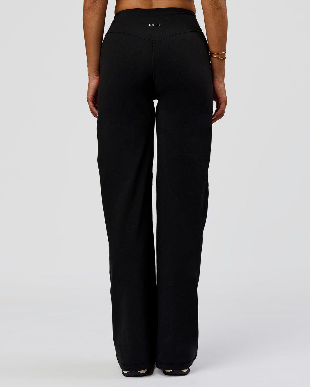 Woman wearing Fusion V-Contour High-Rise Pant - Black | Model:Bianca | Size:S