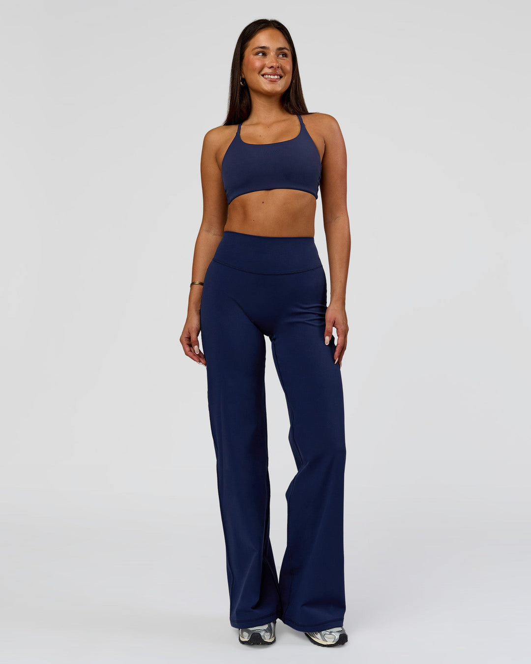 Woman wearing Fusion V-Contour High-Rise Pant - Future Navy | Model:Bianca | Size:S