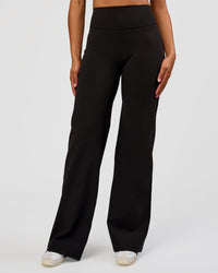 Woman wearing Fusion V-Contour High-Rise Tall Pant - Black | Model:Rosie | Size:S