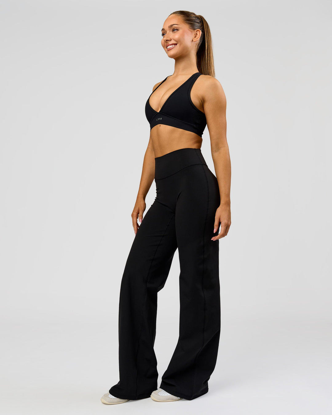 Woman wearing Fusion V-Contour High-Rise Tall Pant - Black | Model:Claire | Size:S