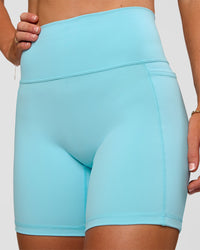 Woman wearing Fusion V-Contour Ultra High-Rise 6" Short Pockets - Baltic Sea | Model:Emelia | Size:S | Thumbnail Index: 6