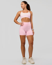 Woman wearing Fusion V-Contour Ultra High-Rise 4” Short Pockets - Marshmallow | Model:Summer | Size:S | Thumbnail Index: 2