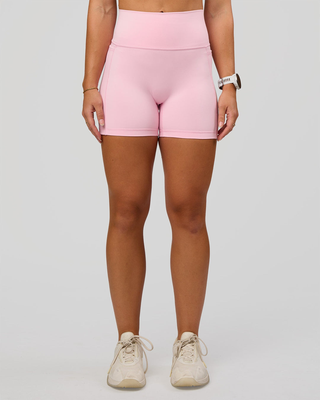 Woman wearing Fusion V-Contour Ultra High-Rise 4” Short Pockets - Marshmallow | Model:Summer | Size:S
