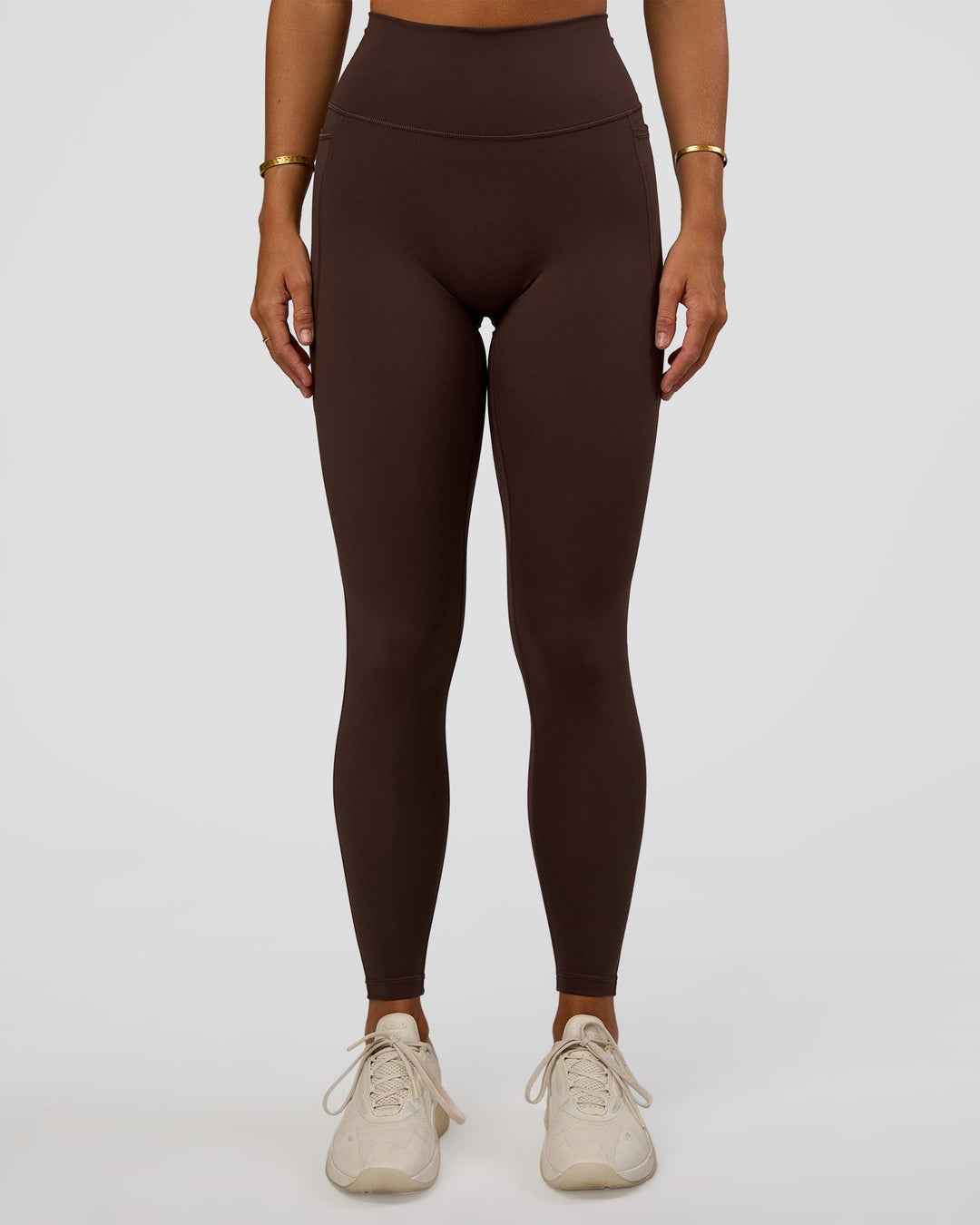 Woman wearing Fusion V-Contour Ultra High-Rise Full Length Legging Pockets - Hot Chocolate | Model:Amity | Size:S