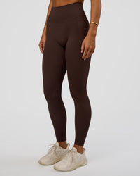 Woman wearing Fusion V-Contour Ultra High-Rise Full Length Legging Pockets - Hot Chocolate | Model:Amity | Size:S