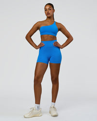 Woman wearing Fusion V-Contour Ultra High-Rise 4" Short Pockets - Palace Blue | Model:Rosie | Size:S