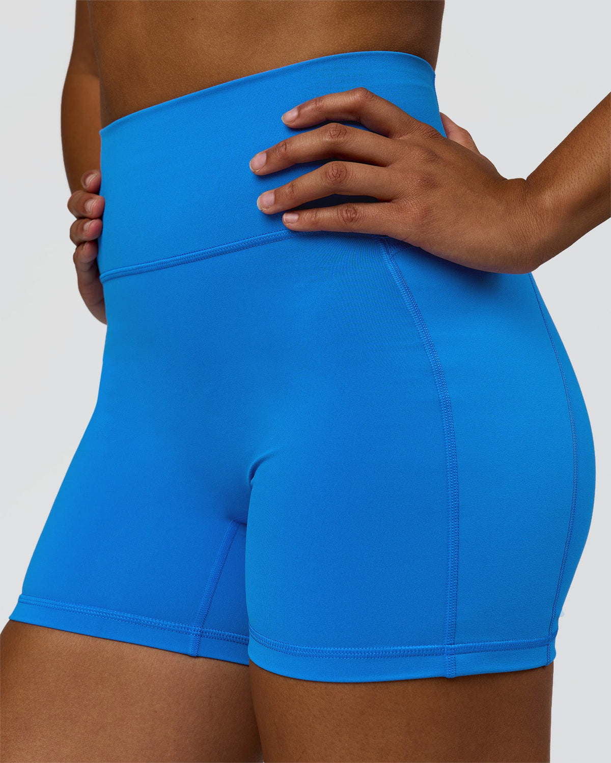 Woman wearing Fusion V-Contour Ultra High-Rise 4" Short Pockets - Palace Blue | Model:Rosie | Size:S