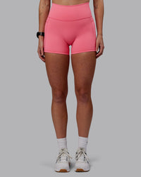 Woman wearing Fusion Ultra High-Rise 4" Short Pockets - Pink Lemonade | Set:true | Angle:front | Model:Shae | Size:S