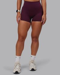 Woman wearing Fusion Ultra High-Rise 4" Short Pockets - Cherry Lacquer | Model:Lyss | Size:S