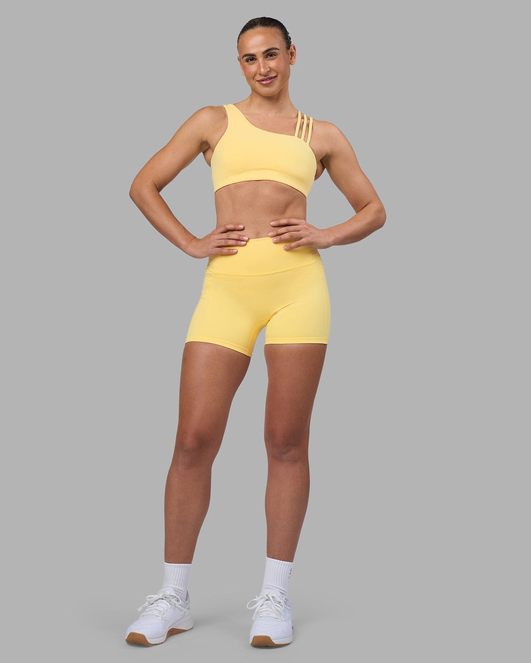 Woman wearing Galvanise Sports Bra 2.0 - Lemon | Model:Sophie | Size:S