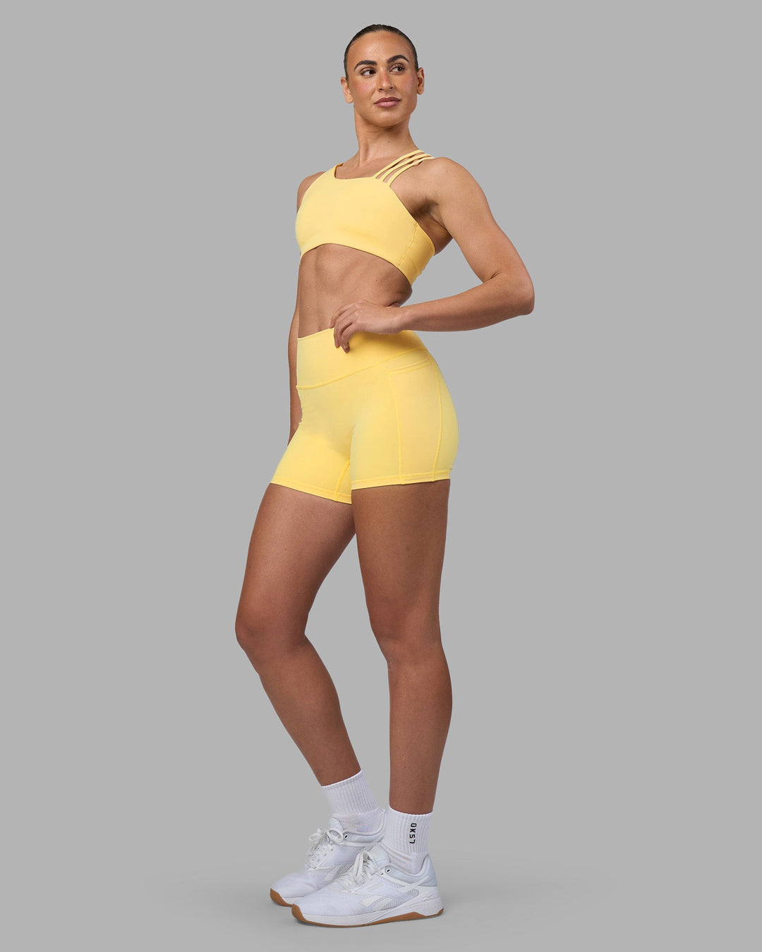 Woman wearing Galvanise Sports Bra 2.0 - Lemon | Model:Sophie | Size:S
