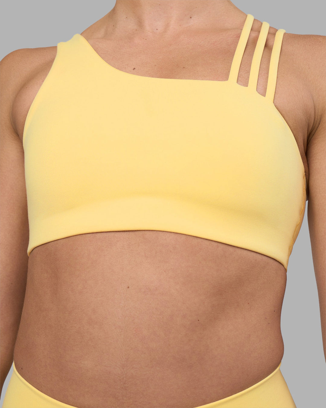 Woman wearing Galvanise Sports Bra 2.0 - Lemon | Model:Sophie | Size:S