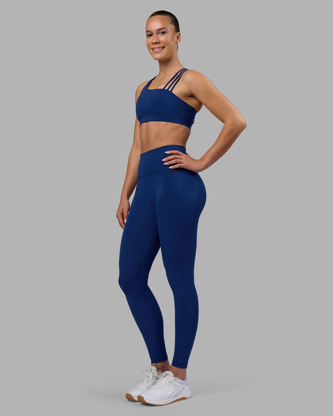 Woman wearing Galvanise Sports Bra 2.0 - Midnight Blue | Model:Charlize | Size:S