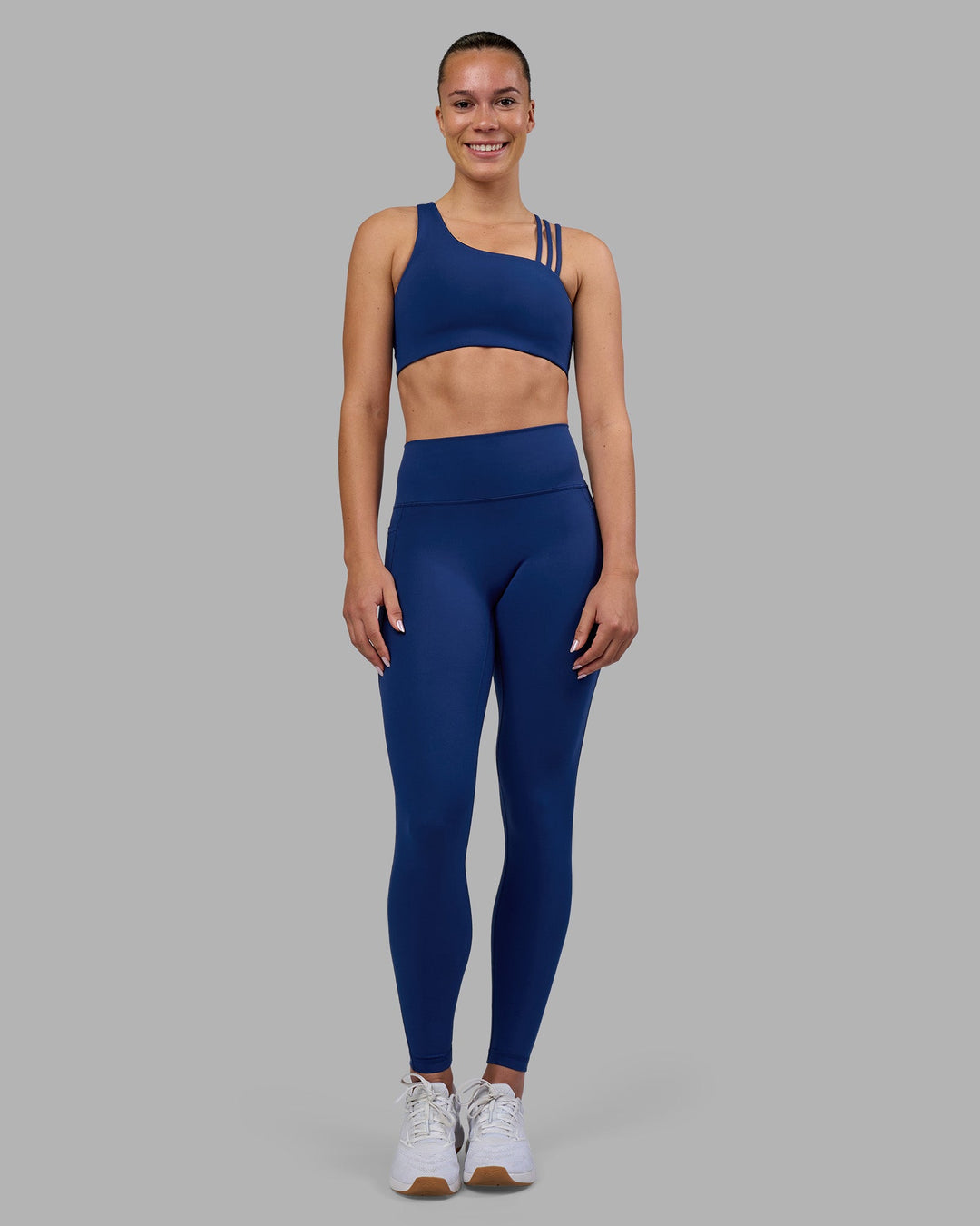 Woman wearing Galvanise Sports Bra 2.0 - Midnight Blue | Model:Charlize | Size:S