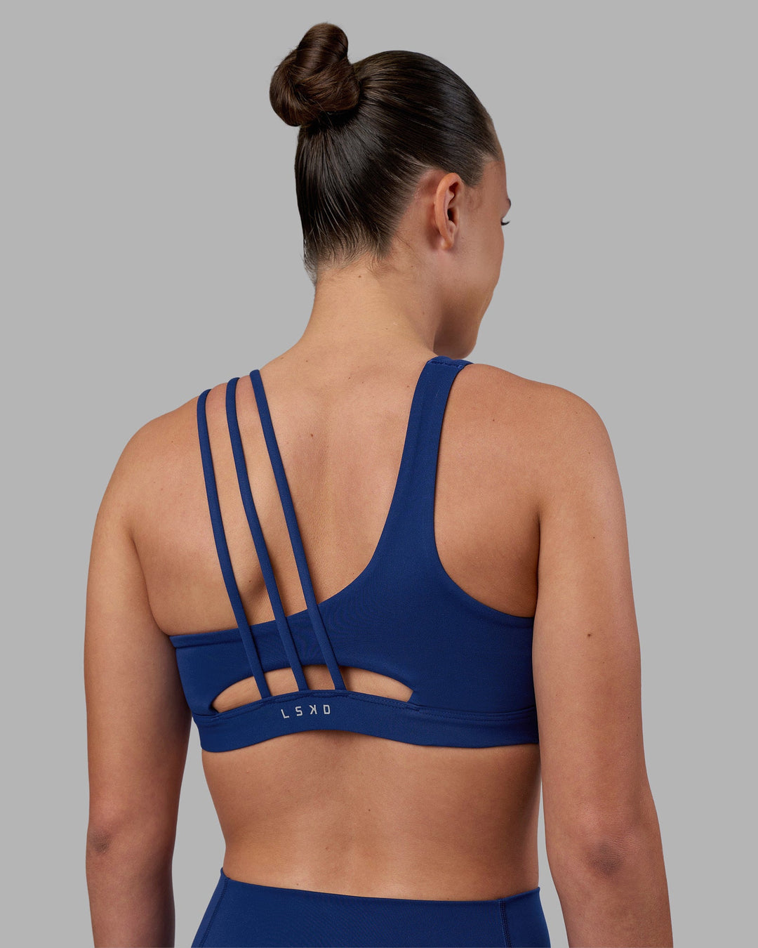 Woman wearing Galvanise Sports Bra 2.0 - Midnight Blue | Model:Charlize | Size:S