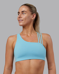 Woman wearing Galvanise Sports Bra 2.0 - Retro Blue | Model:Hannah | Size:S | Thumbnail Index: 0