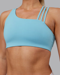 Woman wearing Galvanise Sports Bra 2.0 - Retro Blue | Model:Hannah | Size:S | Thumbnail Index: 3