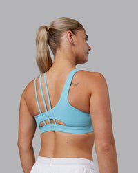Woman wearing Galvanise Sports Bra 2.0 - Retro Blue | Model:Hannah | Size:S | Thumbnail Index: 1