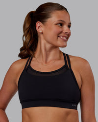 Woman wearing Genesis Layered Sports Bra - Black | Model:Phoebe | Size:S | Thumbnail Index: 2