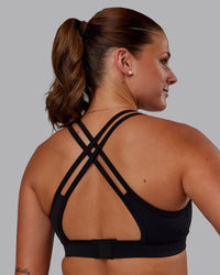Woman wearing Genesis Layered Sports Bra - Black | Model:Phoebe | Size:S | Thumbnail Index: 1