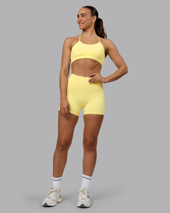 Woman wearing Glow Sports Bra - Lemon
