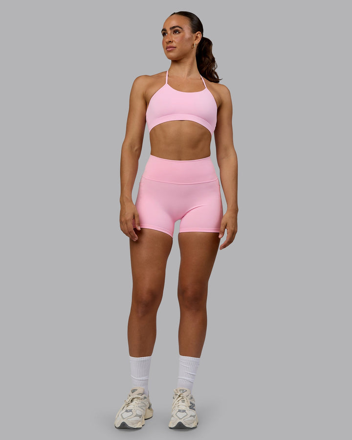 Woman wearing Glow Sports Bra - Pale Pink
