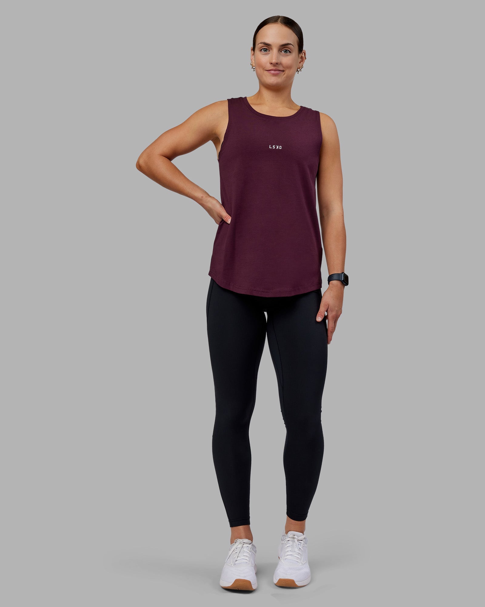 Woman wearing Go-To FLXCotton Longline Tank - Cherry Lacquer-White | Model:Keisha | Size:S