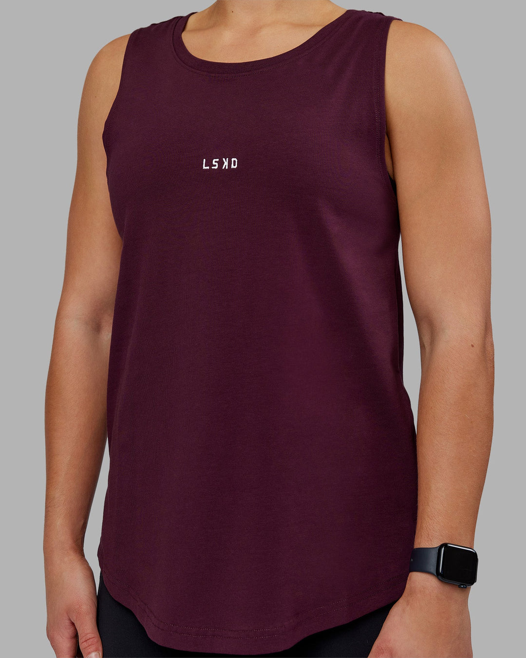 Woman wearing Go-To FLXCotton Longline Tank - Cherry Lacquer-White | Model:Keisha | Size:S