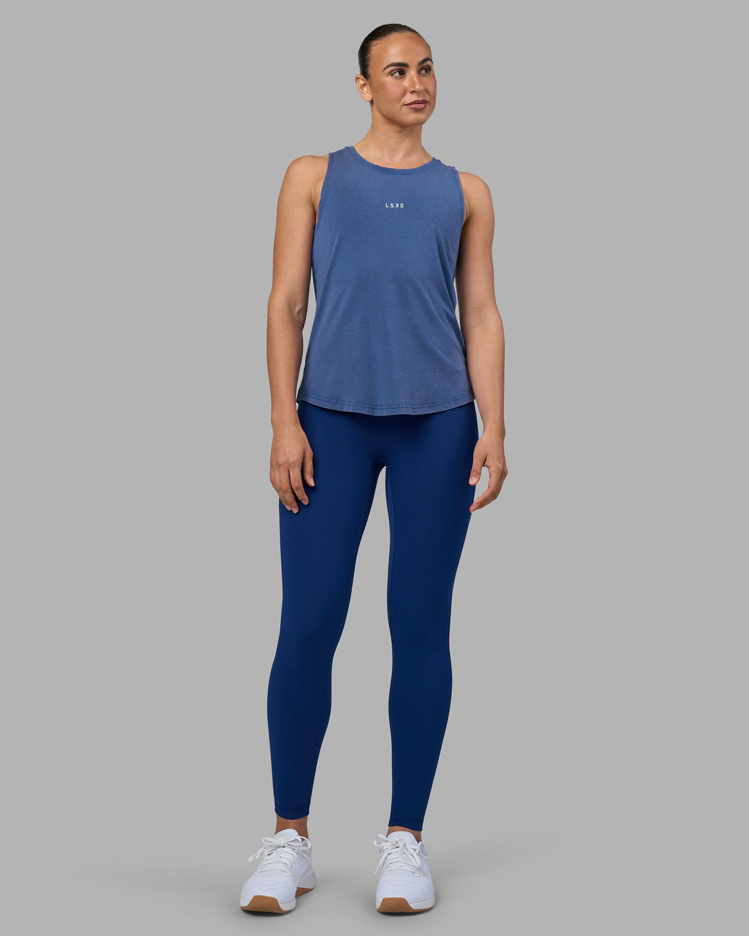Woman wearing Go-To FLXCotton Longline Tank - Midnight Blue Washed-White | Model:Sophie | Size:S
