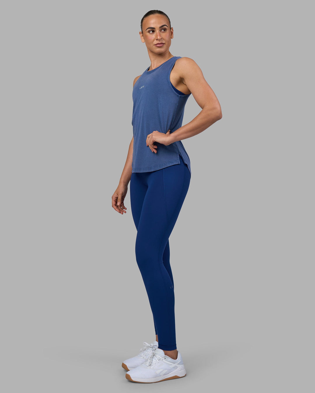 Woman wearing Go-To FLXCotton Longline Tank - Midnight Blue Washed-White | Model:Sophie | Size:S