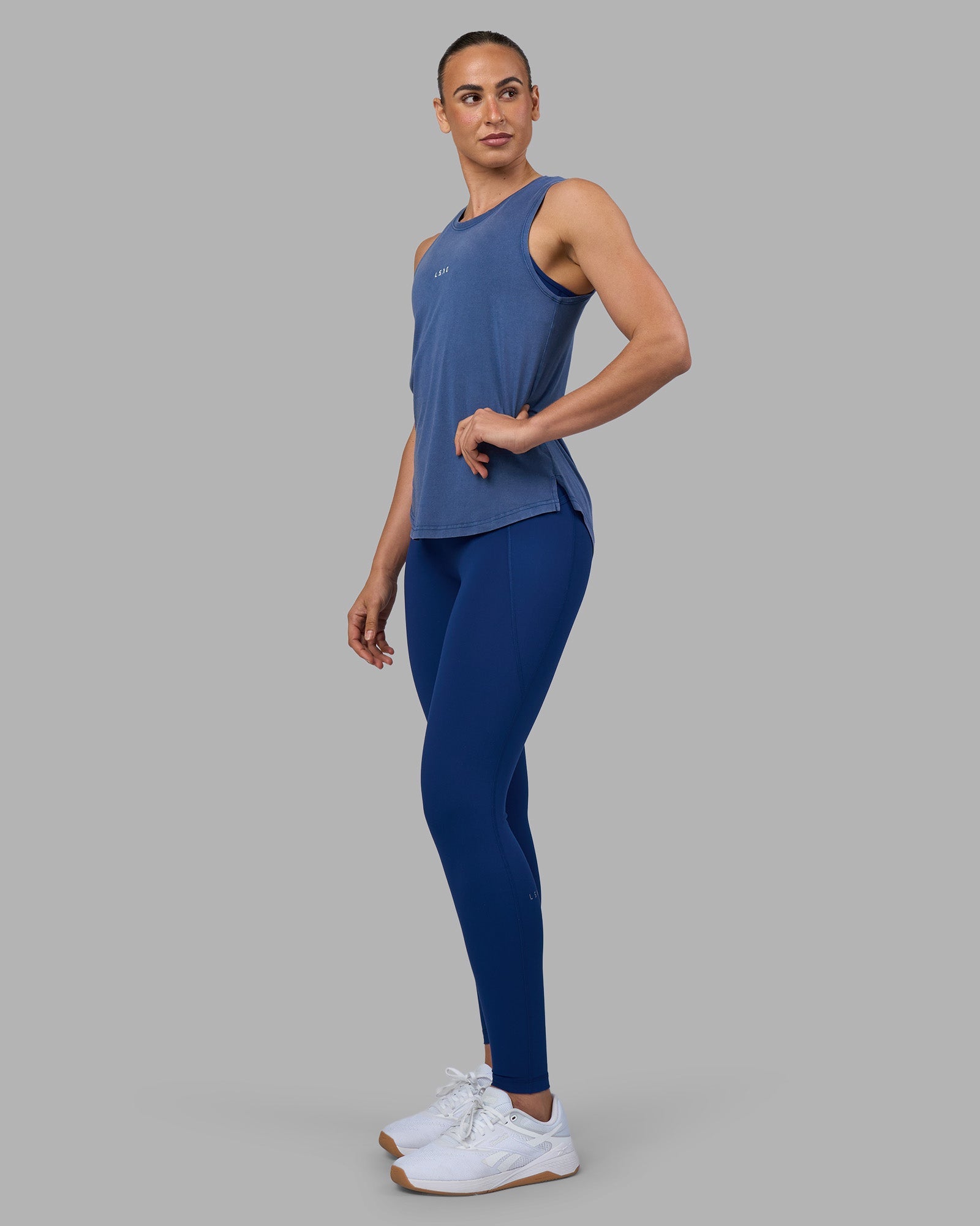 Woman wearing Go-To FLXCotton Longline Tank - Midnight Blue Washed-White | Model:Sophie | Size:S