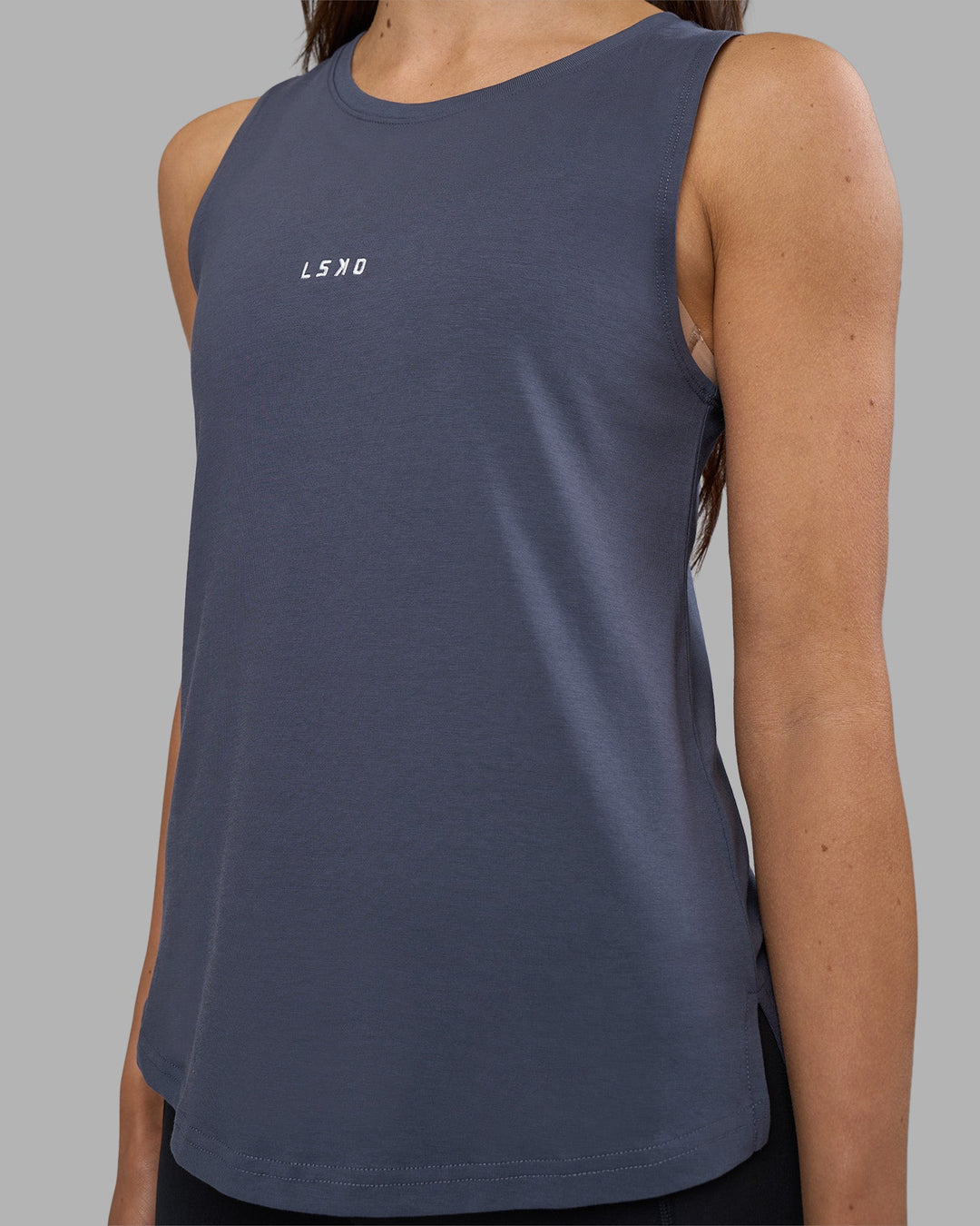 Woman wearing Go-To FLXCotton Longline Tank - Night Shadow-White | Model:Phoebe | Size:S