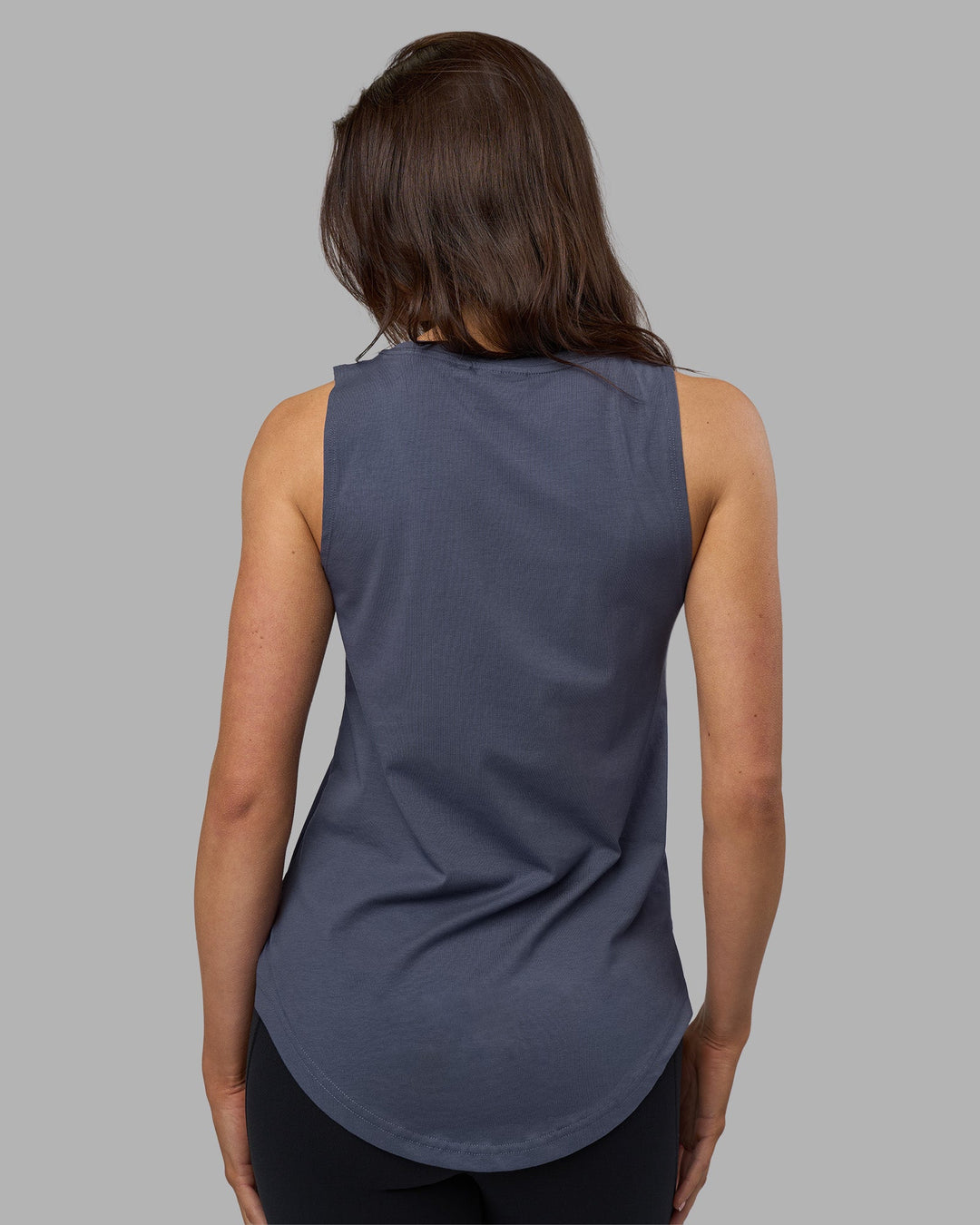 Woman wearing Go-To FLXCotton Longline Tank - Night Shadow-White | Model:Phoebe | Size:S